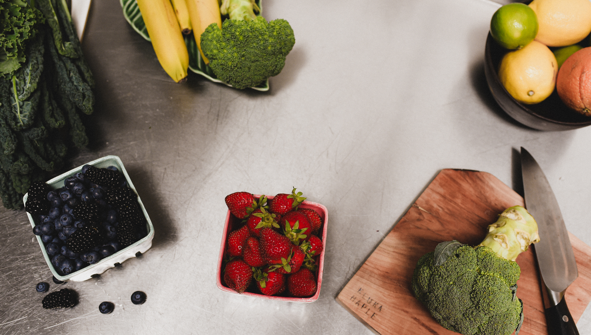 Seasonal produce and plant-based ingredients on a kitchen counter